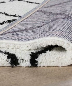 Hochflor Teppich Quadratisch Rautenmuster Artisan - Weiß/Schwarz - close up vouw, thumbnail Hochflor Teppich Quadratisch Rautenmuster Artisan - Weiß/Schwarz - close up vouw, thumbnail