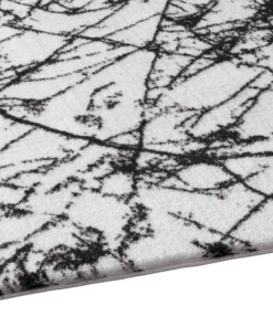 Waschbarer Teppich Marmor Optik - Chloé Weiß/Schwarz - close up zijkant, thumbnail Waschbarer Teppich Marmor Optik - Chloé Weiß/Schwarz - close up zijkant, thumbnail